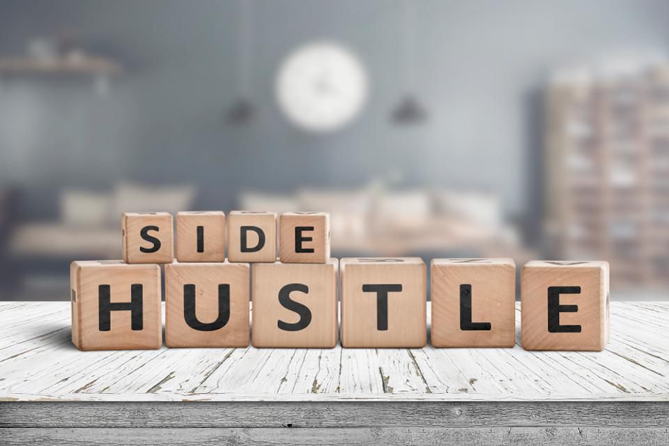 Side Hustle spelled out in crossword pieces