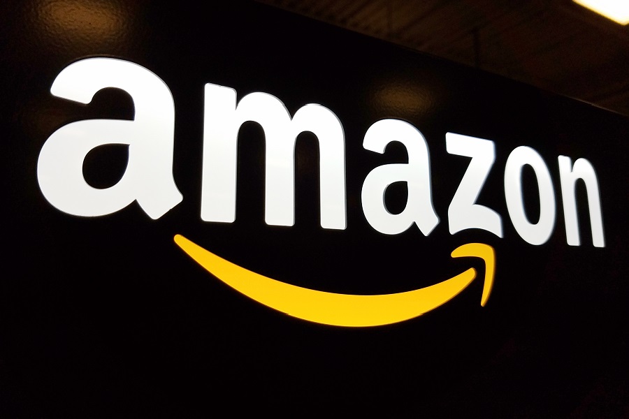 Amazon logo backlighting over black blackground