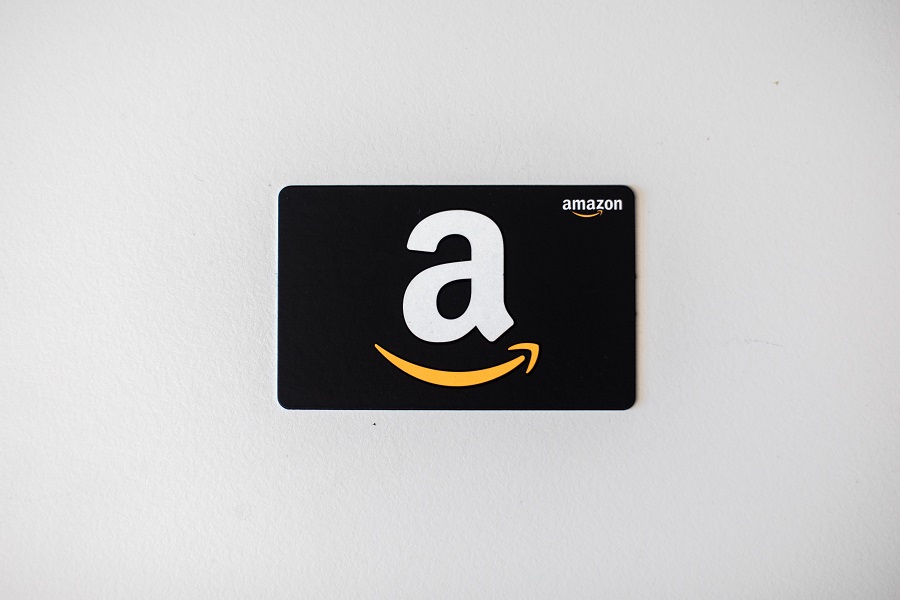 Amazon gift card over white parchment background