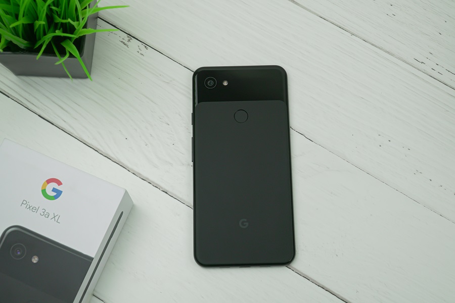 Google Pixel 3a XL phone on a white wooden background