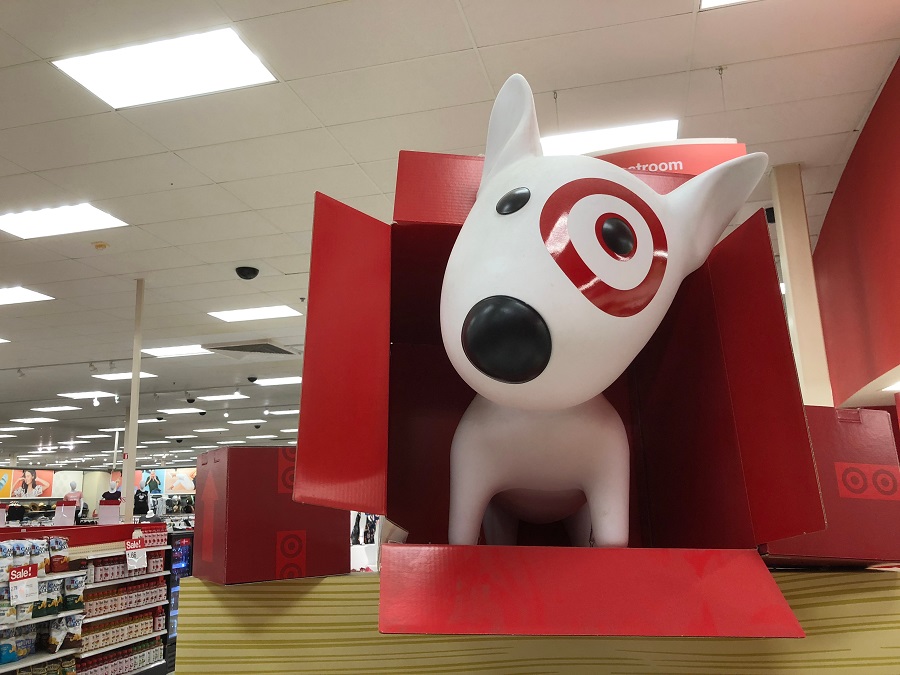 Target dog mascot popping out of a box in a store