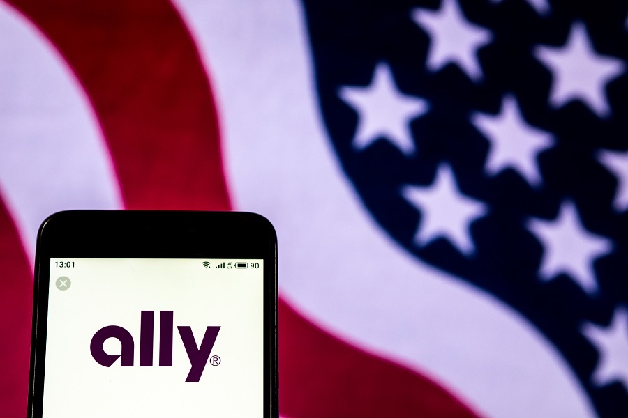 Ally Bank logo on phone with American flag background