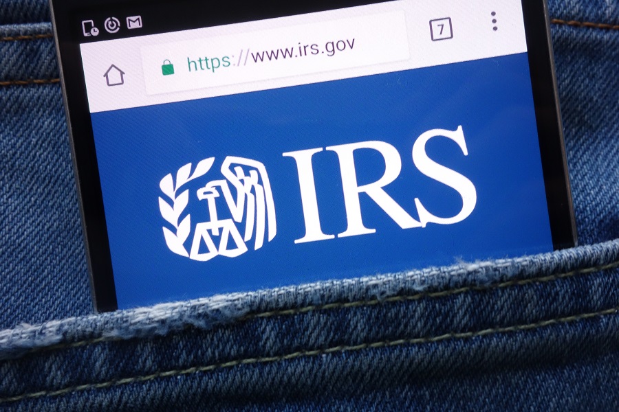 IRS logo on phone in a person's back pocket