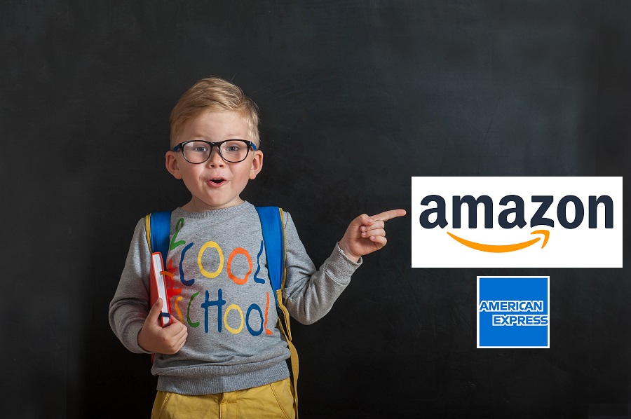Ready for school boy pointing at Amazon logo on blackboard