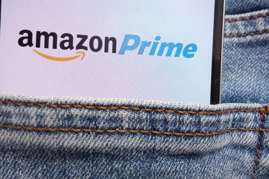 Amazon Prime logo on phone in back jeans pocket