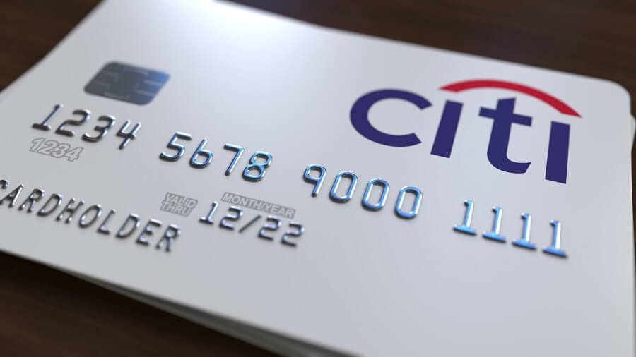 Citi card in white against wooden background