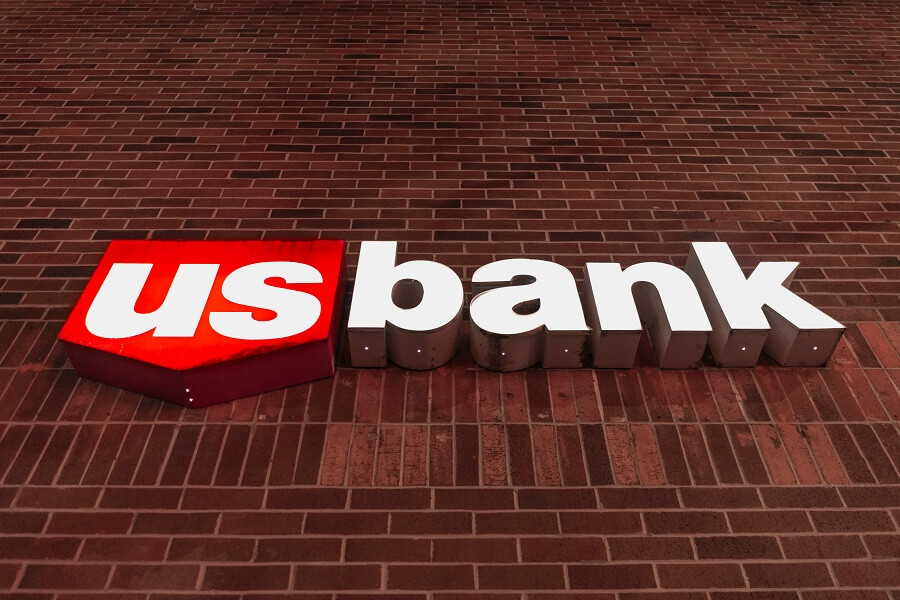 U.S. Bank logo sign on red brick wall
