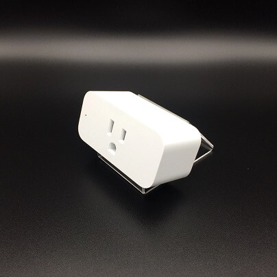 Amazon smart plug over a black background